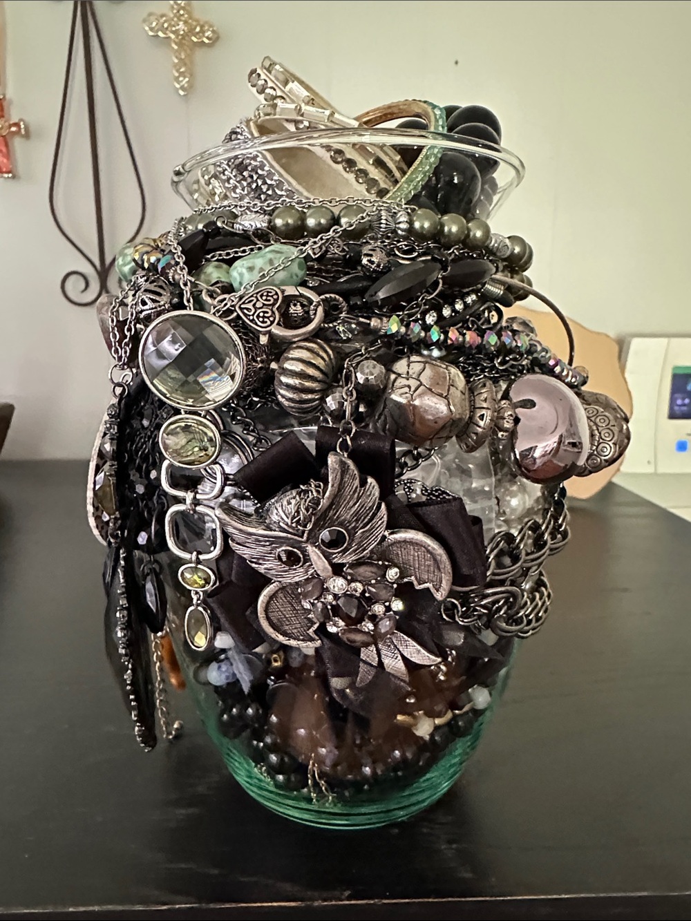 Mystery JewelryJar In Shades Of Black, Silver, And Green Colors.